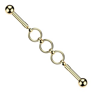Zlacený industrial piercing s kroužky